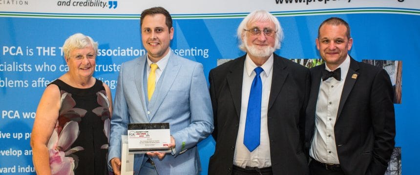 Surveyor collecting an award at the PCA awards