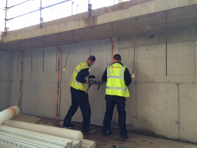 Two waterproofing experts working