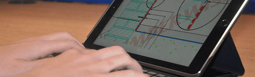 Closeup of surveyor designing a CAD diagram on an iPad
