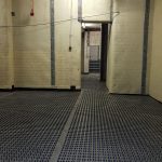 Membrane applied to the walls and floor in a basement