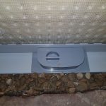 Closeup of a drainage perimeter with an inspection port