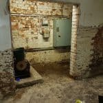 Damp basement with exposed brickwork