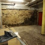 Damp basement with exposed brickwork