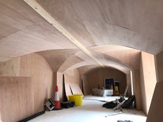 The basement with the wooden cladding applied to walls and moves
