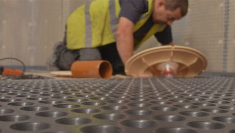 Engineer servicing a basement pump