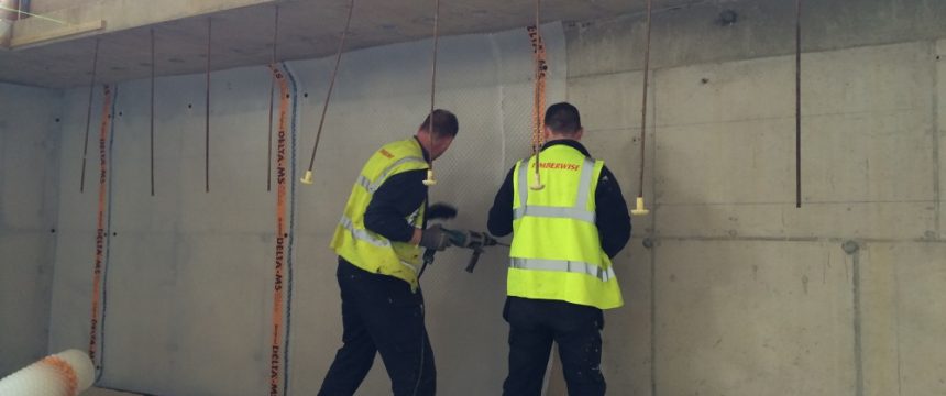 Technicians carrying out tanking works