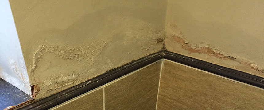 Damp marks forming on bathroom wall