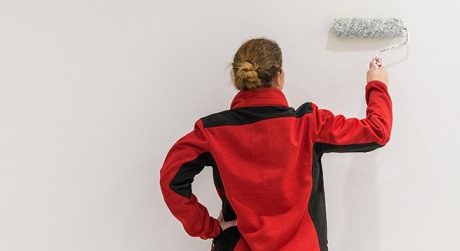 Damp proof paint being applied onto wall