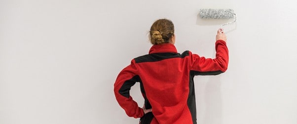 Damp proof paint being applied onto wall