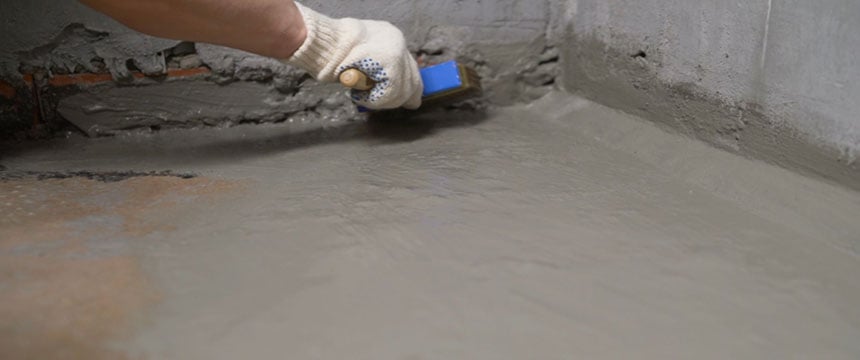 Engineer applying internal garage waterproofing