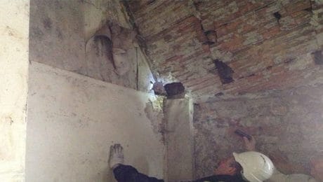 Surveyors carrying out checks for damp and condensation in loft