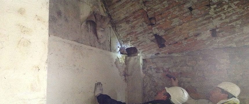 Surveyors carrying out checks for damp and condensation in loft