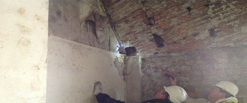 Surveyors carrying out checks for damp and condensation in loft