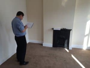 Surveyor carrying out condensation survey