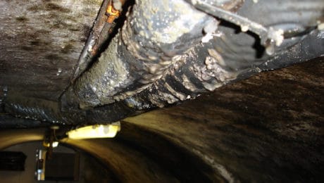 Closeup of condensation droplets forming on a basement roof