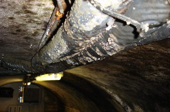 Closeup of condensation droplets forming on a basement roof