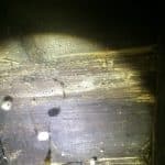 Closeup of common furniture beetle damage to timbers